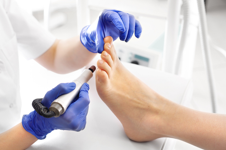 Technician performing a medical pedicure