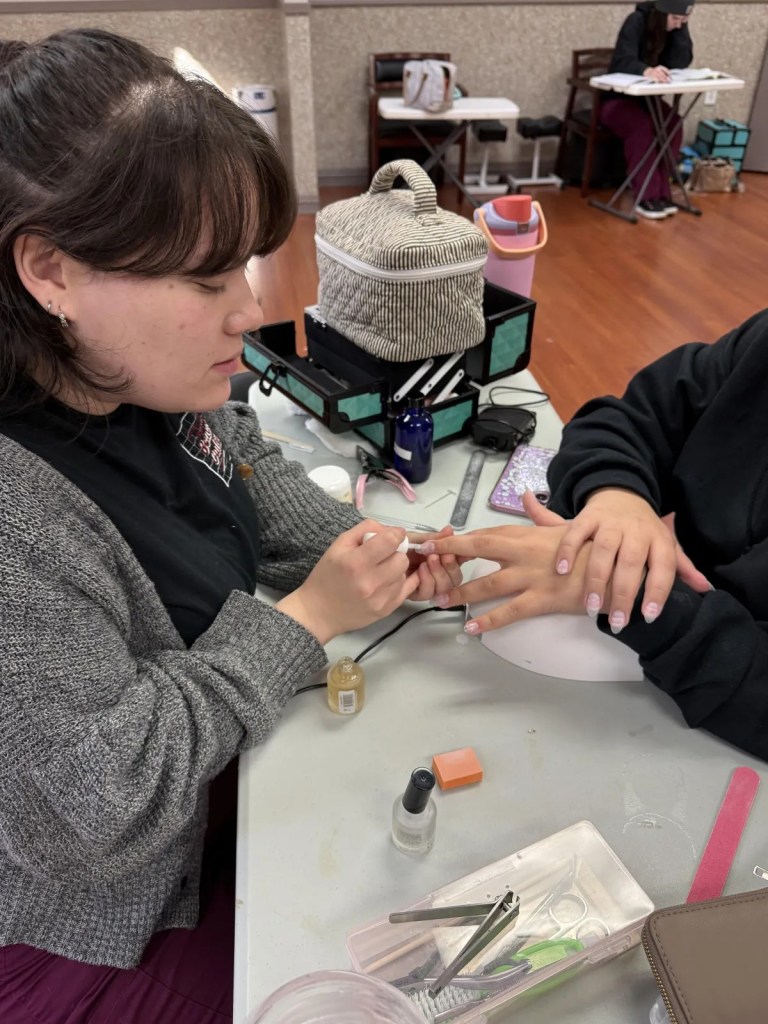 BCSBC nail technology student doing a manicure